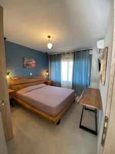 En eller flere senge i et værelse på Mirovigli Family rooms