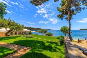 a park with a view of the water at Al Mare Apartments in Rovinj