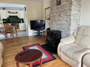 TV a/nebo společenská místnost v ubytování Beechwood Lodge