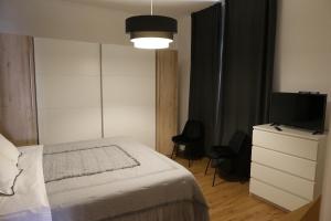 Un pat sau paturi într-o cameră la CasaMica L'Aquila