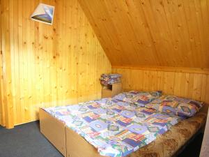 Posteľ alebo postele v izbe v ubytovaní Domek w dolinie Kościeliskiej