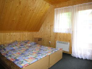 Posteľ alebo postele v izbe v ubytovaní Domek w dolinie Kościeliskiej