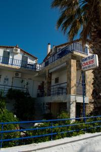 a building with a sale sign in front of it at Efterpi Aggeli in Loutrópolis Thermís