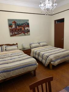 Postel nebo postele na pokoji v ubytování La Chocita Ward