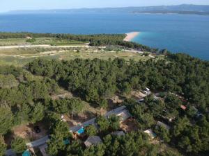 an aerial view of a beach and the ocean at Abeille Maison Glamping Resort Zlatni Rat -Adults Only in Bol