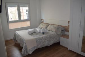 Postel nebo postele na pokoji v ubytování Nuevo apartamento céntrico junto al mar