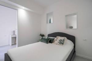 Postel nebo postele na pokoji v ubytování Ormesini Courtyard Apartment