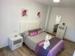 Llit o llits en una habitació de La Casita Alere en Playa Carnota con patio y barbacoa