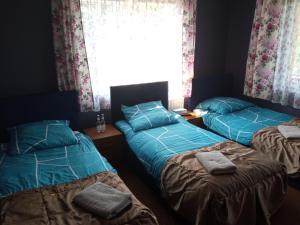 Postel nebo postele na pokoji v ubytování Willa Poniatowskiego