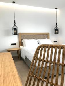 Postel nebo postele na pokoji v ubytování blue sea suites + 21 fotografií