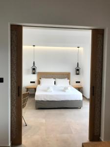Postel nebo postele na pokoji v ubytování blue sea suites