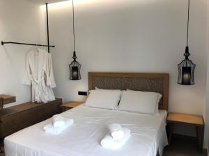 Postel nebo postele na pokoji v ubytování blue sea suites