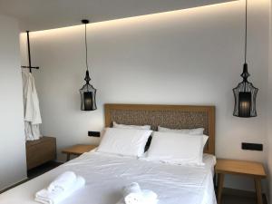 Postel nebo postele na pokoji v ubytování blue sea suites