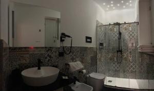 Ванна кімната в Case vacanze donna Ina