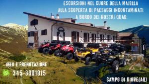 a group of atvs parked in front of a building at B&B IL VECCHIO LUPO in Campo di Giove