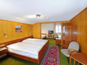 Postel nebo postele na pokoji v ubytování Hotel Alphubel