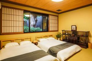 Tempat tidur dalam kamar di Shirakabanoyado - Izumi