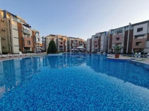 The swimming pool at or close to Studio Apartment with balcony 300m from beach