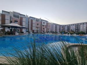 The swimming pool at or close to Studio Apartment with balcony 300m from beach