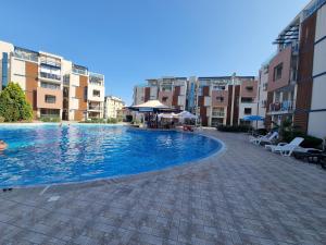 The swimming pool at or close to Studio Apartment with balcony 300m from beach