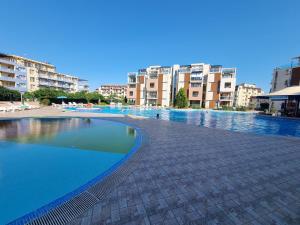 The swimming pool at or close to Studio Apartment with balcony 300m from beach