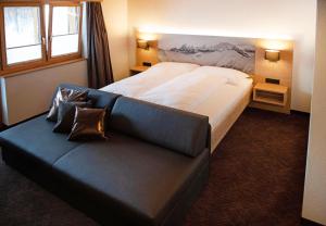 Voodi või voodid majutusasutuse Hotel Bergführer toas