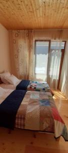 Rúm í herbergi á Guest house Lekhtagi