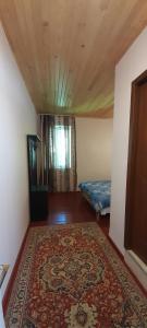 Rúm í herbergi á Guest house Lekhtagi