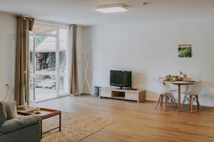 TV a/nebo společenská místnost v ubytování Villa Laurus Residence