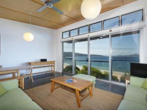 a living room with a view of the ocean at Sea Shack in Seal Rocks