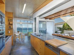 a kitchen with a view of the ocean at Sea Shack in Seal Rocks
