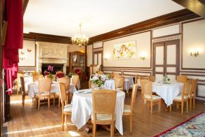 En restaurang eller annat matställe på Chambre d'Hôtes Au Jardin Des Saveurs
