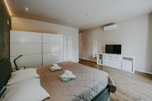 Postel nebo postele na pokoji v ubytování Villa Laurus Residence + 44 fotografií