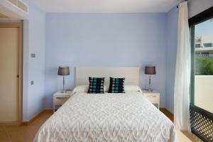 A bed or beds in a room at Villa Pueblo Don Thomas