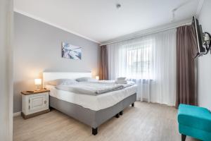 Postel nebo postele na pokoji v ubytování Seegarten Appartements Büsum