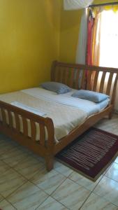 Postel nebo postele na pokoji v ubytování Sky Inn