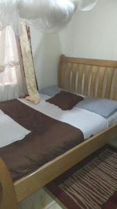 Postel nebo postele na pokoji v ubytování Sky Inn + 9 fotografií