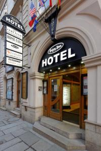 a hotel sign on the front of a building at Enjoy Inn in Plzeň