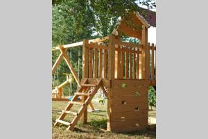 a wooden play set with a ladder and a wooden playset at ČAROBNA ŠUMA ***(magic forest) in Karlovac