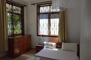 เตียงในห้องที่ Barazani Garden Villa