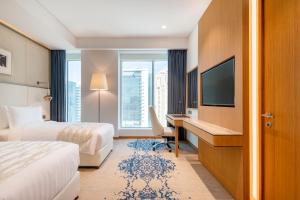 Jouri a Murwab hotel Doha客房内的一张或多张床位