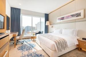 Jouri a Murwab hotel Doha客房内的一张或多张床位
