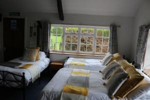 Llit o llits en una habitació de The Hostelrie at Goodrich