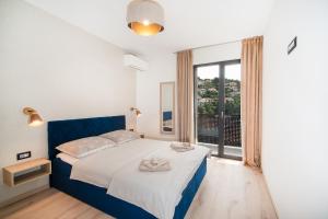 Postel nebo postele na pokoji v ubytování Apartments Marea