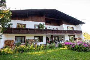 a house with flowers in front of it at Haus Kogler in Inzersdorf im Kremstal