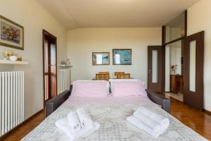 A bed or beds in a room at Attico Panoramico