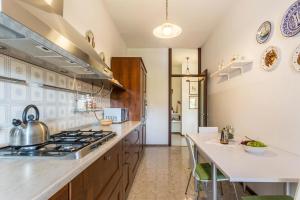 A kitchen or kitchenette at Attico Panoramico