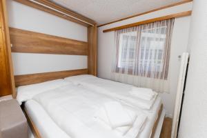Un pat sau paturi într-o cameră la Haus Slalom