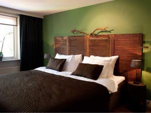 Ліжко або ліжка в номері Hotel & Restaurant Meneer Van Eijck