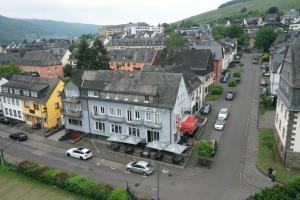 an aerial view of a town with cars on a street at Hotel Dolce Vita in Bernkastel-Kues